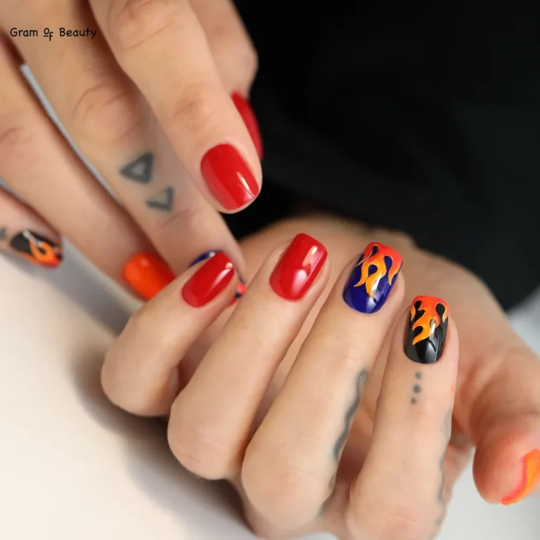 Czerwony manicure hybrydowy ze zdobieniem - salon Gram Of Beauty w Warszawie